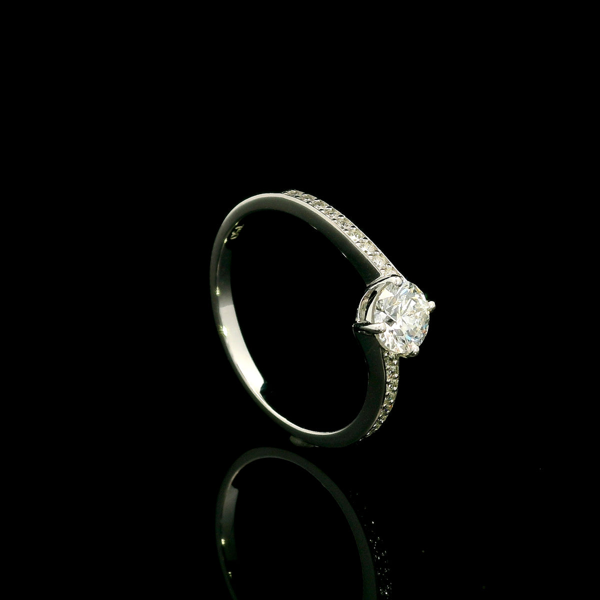 GIA certified round diamond engagement ring in 18K white gold with curved diamond band