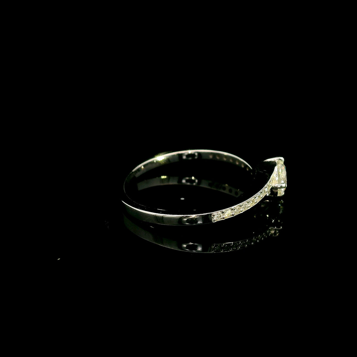 GIA certified round diamond engagement ring in 18K white gold with curved diamond band