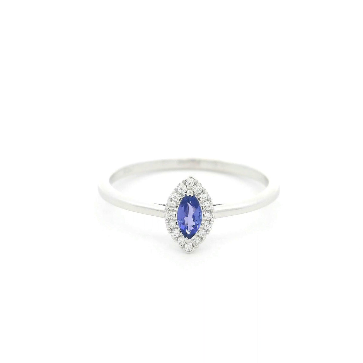 Dainty marquise tanzanite and diamond halo ring in 18K white gold with a slim polished band.