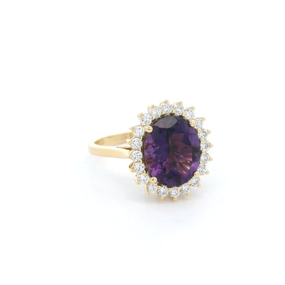 Oval amethyst and diamond halo ring in 18K yellow gold