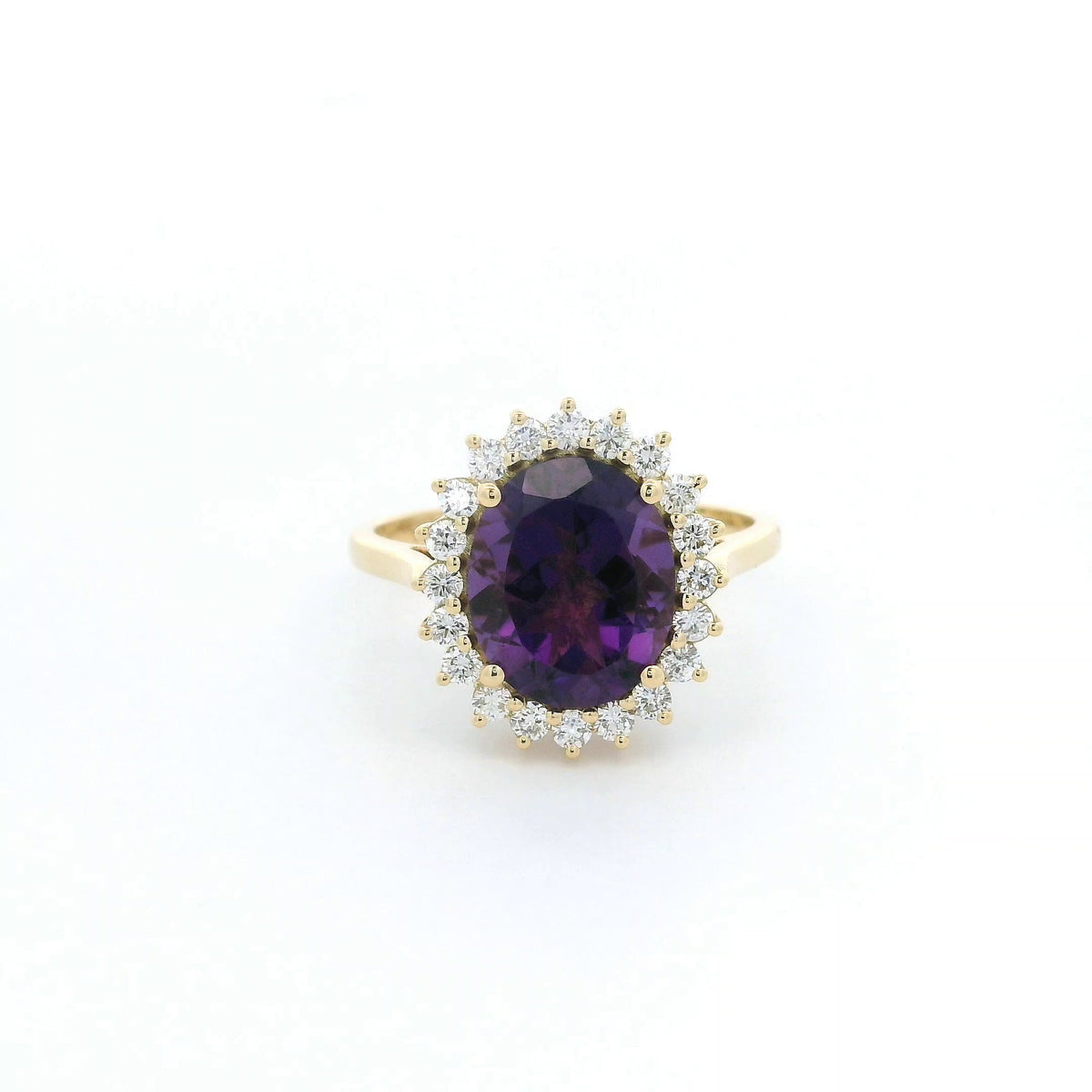 Oval amethyst and diamond halo ring in 18K yellow gold