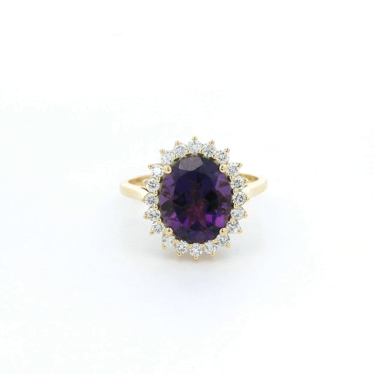 Oval amethyst and diamond halo ring in 18K yellow gold