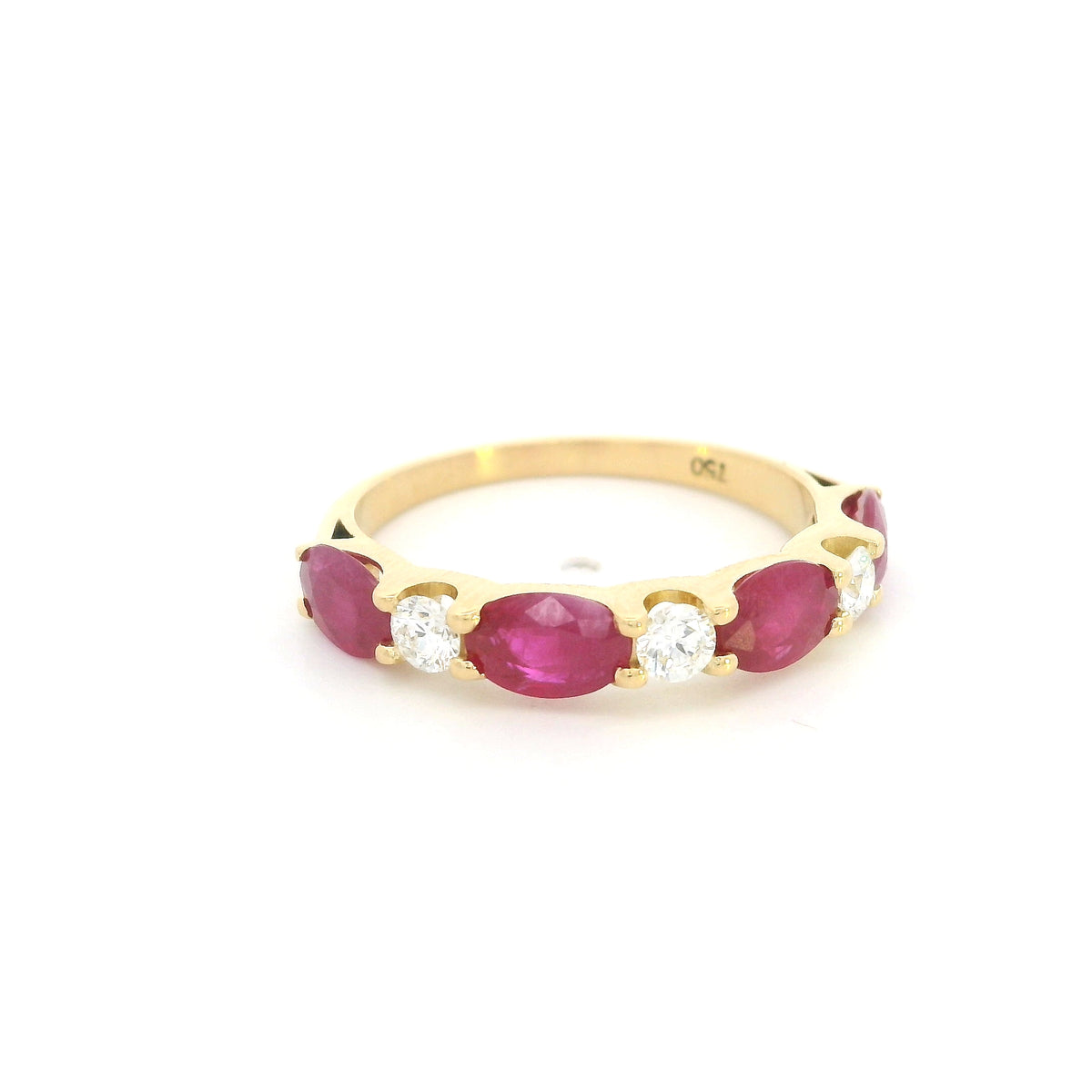 Ruby and diamond ring in 18K yellow gold with alternating oval rubies and round diamonds