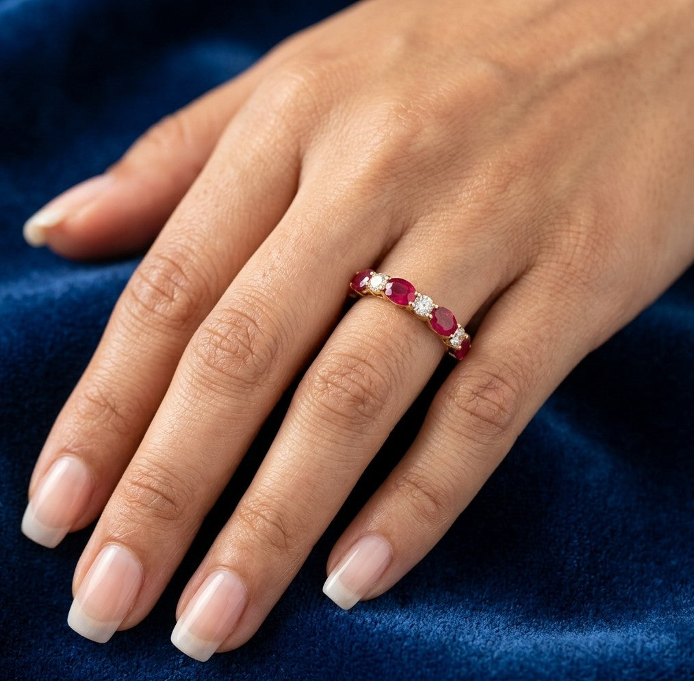 Ruby and diamond ring in 18K yellow gold with alternating oval rubies and round diamonds