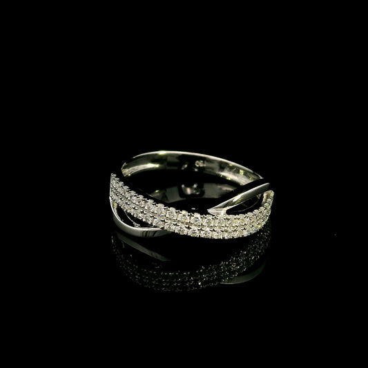 18K white gold crossover ring featuring two curved rows of round diamonds intertwined with smooth, polished gold bands.