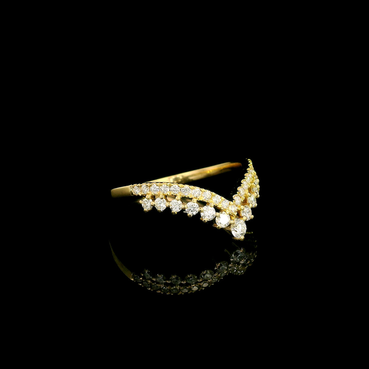 V shaped diamond chevron ring in 18K yellow gold featuring pavé-set diamonds and graduated round diamonds, designed as a statement ring or contour wedding band.