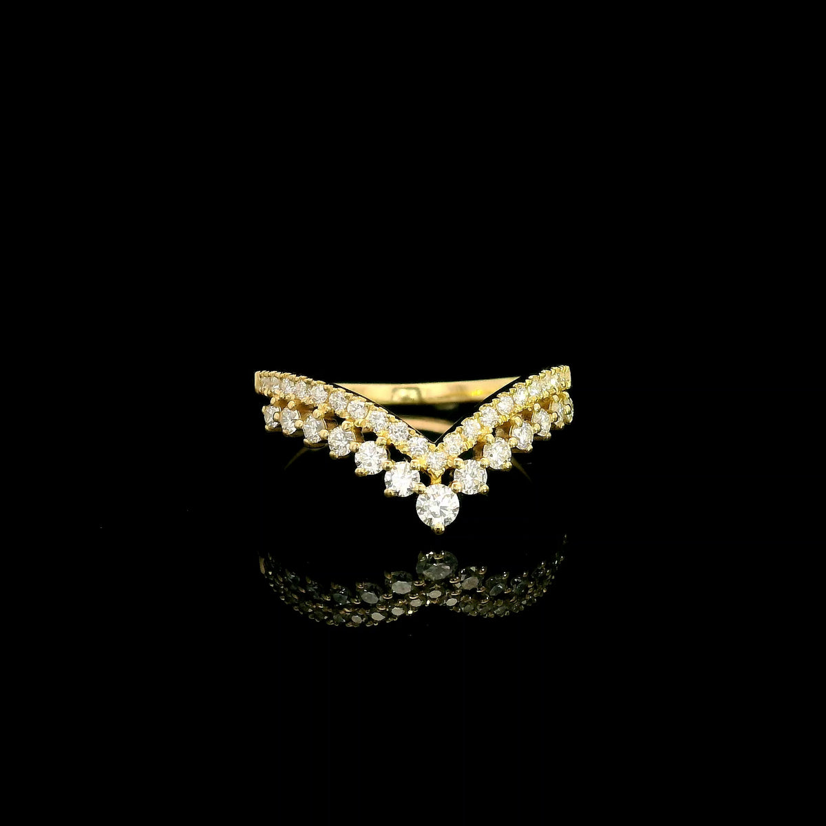 V shaped diamond chevron ring in 18K yellow gold featuring pavé-set diamonds and graduated round diamonds, designed as a statement ring or contour wedding band.