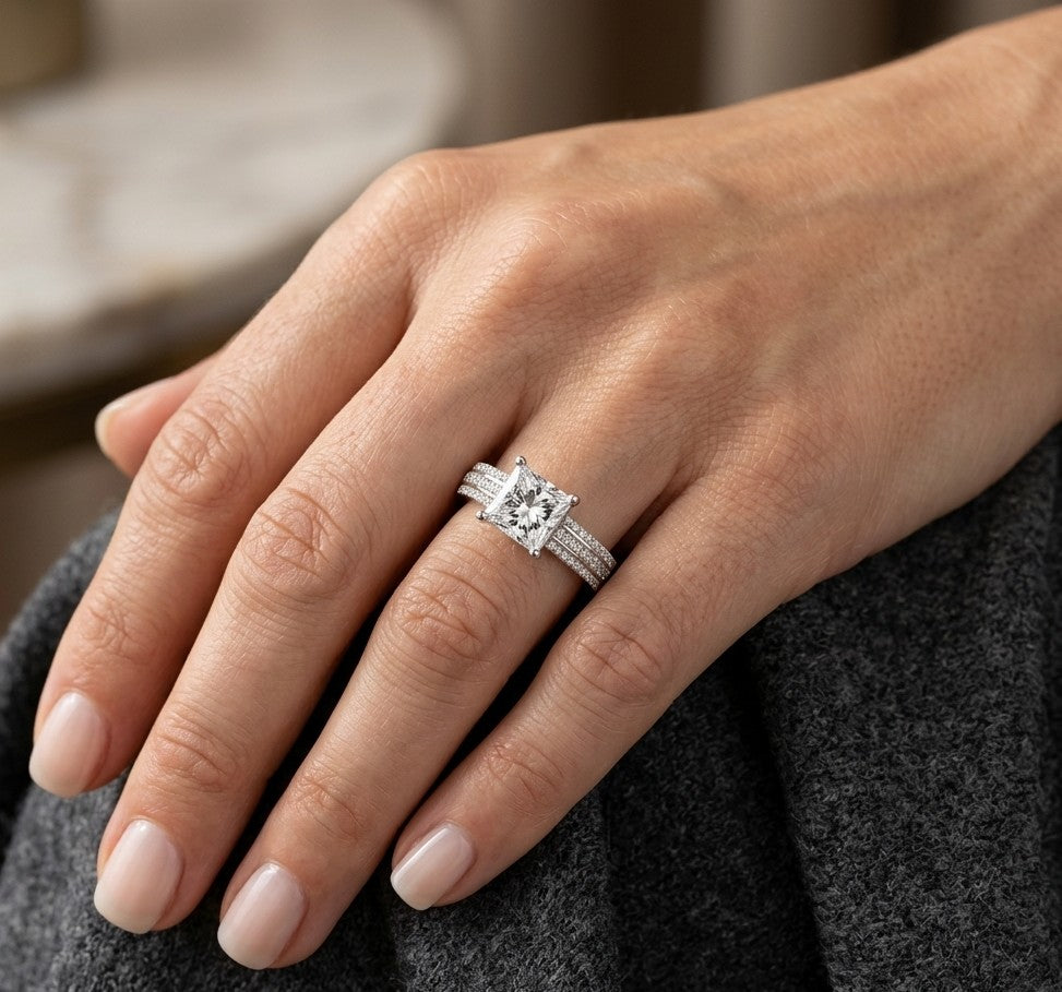 Natural princess cut diamond engagement ring in 18K white gold featuring a 2.19 carat IGI-certified F colour VS1 clarity centre diamond and 0.42 carat of round diamonds along the pavé-set band.