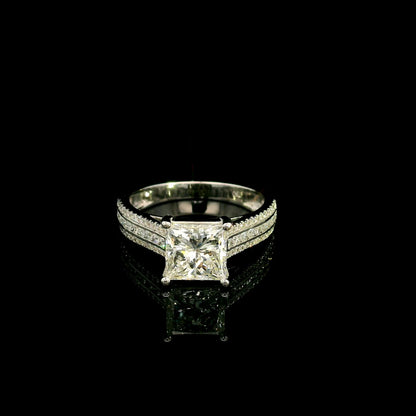 Natural princess cut diamond engagement ring in 18K white gold featuring a 2.19 carat IGI-certified F colour VS1 clarity centre diamond and 0.42 carat of round diamonds along the pavé-set band.