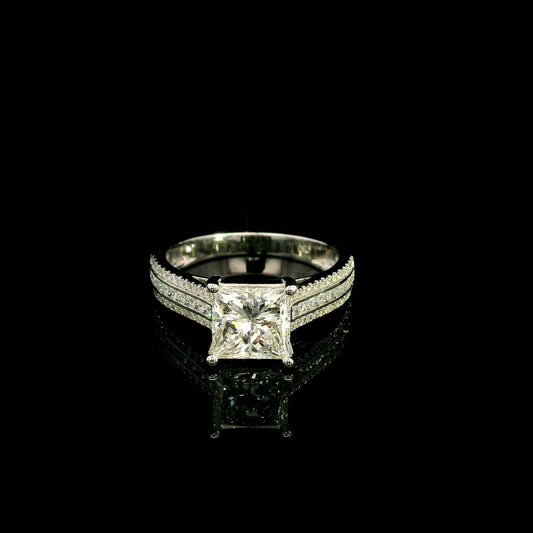 Natural princess cut diamond engagement ring in 18K white gold featuring a 2.19 carat IGI-certified F colour VS1 clarity centre diamond and 0.42 carat of round diamonds along the pavé-set band.