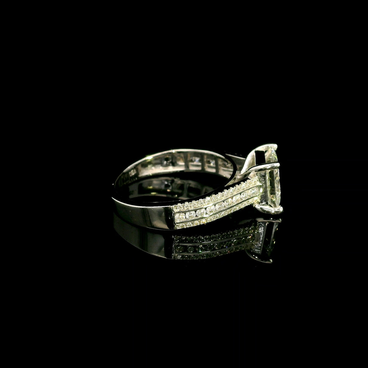 Natural princess cut diamond engagement ring in 18K white gold featuring a 2.19 carat IGI-certified F colour VS1 clarity centre diamond and 0.42 carat of round diamonds along the pavé-set band.