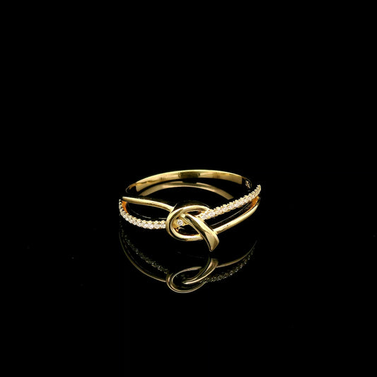 18K yellow gold ring with an intertwined polished gold knot at the centre and  sweeping row of small round diamonds.