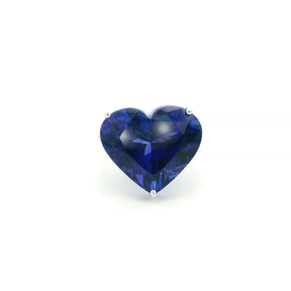Heart shaped tanzanite ring in 18K white gold featuring a 25.18 carat blue-violet gemstone and diamond-set shoulders.