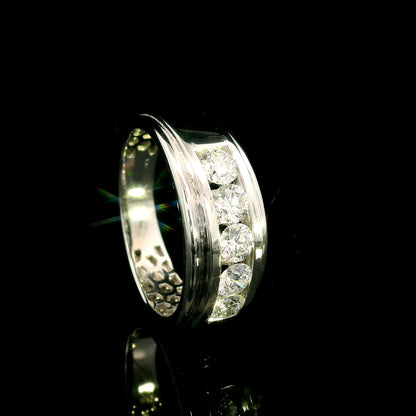 Men's 18K white gold band with five round diamonds in a channel-style setting framed by broad polished gold edges.