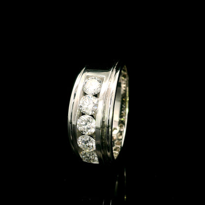 Men's 18K white gold band with five round diamonds in a channel-style setting framed by broad polished gold edges.