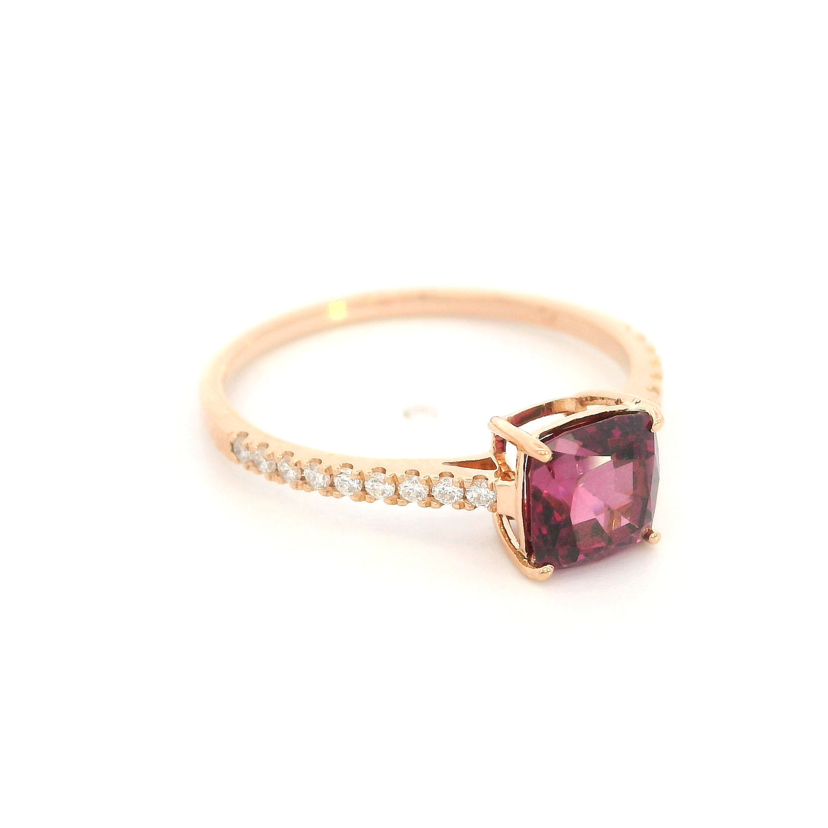 18K rose gold ring with a cushion-cut raspberry-pink rhodolite garnet and pavé diamond shoulders.
