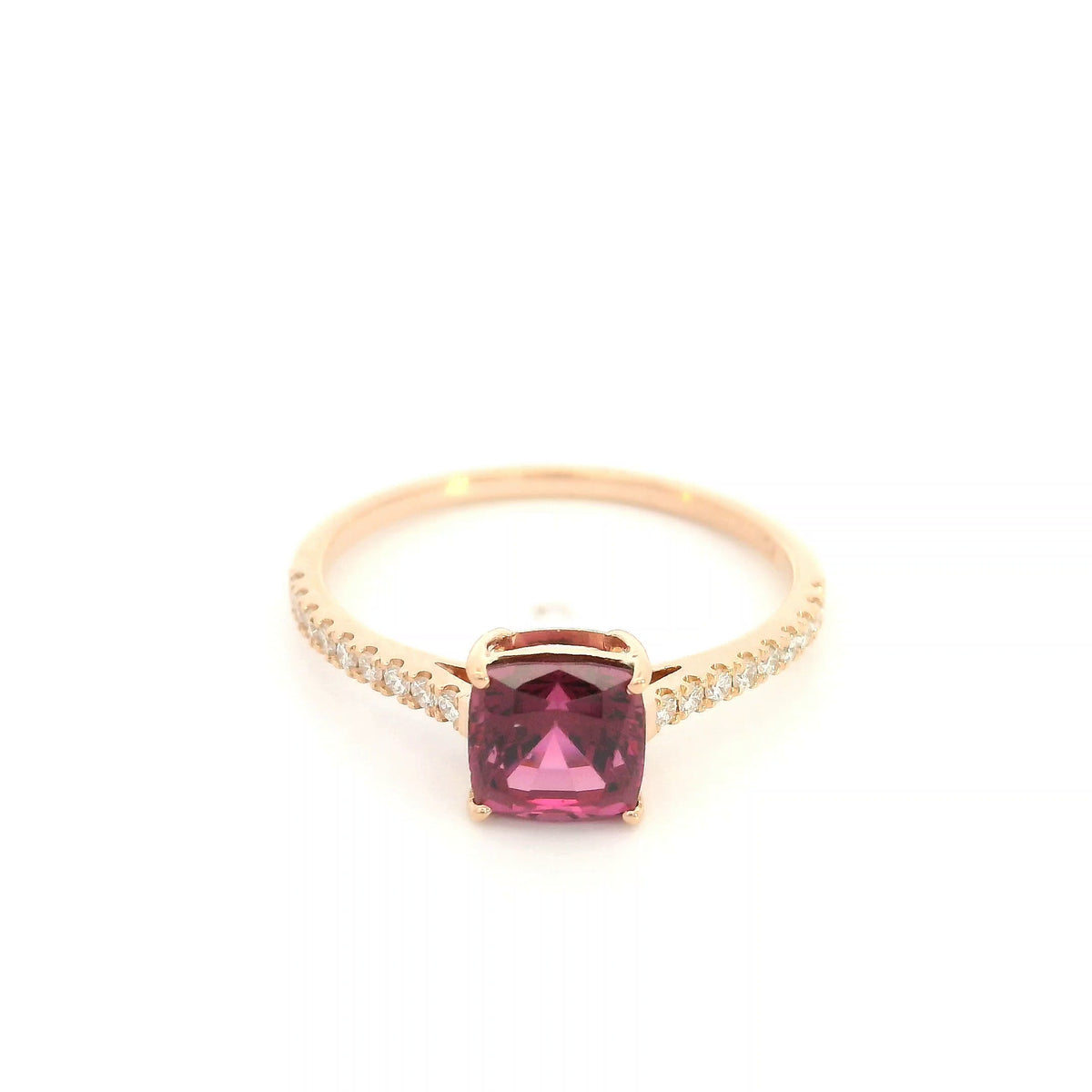 18K rose gold ring with a cushion-cut raspberry-pink rhodolite garnet and pavé diamond shoulders.