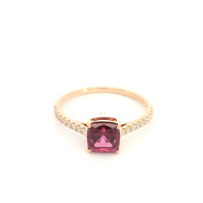 18K rose gold ring with a cushion-cut raspberry-pink rhodolite garnet and pavé diamond shoulders.