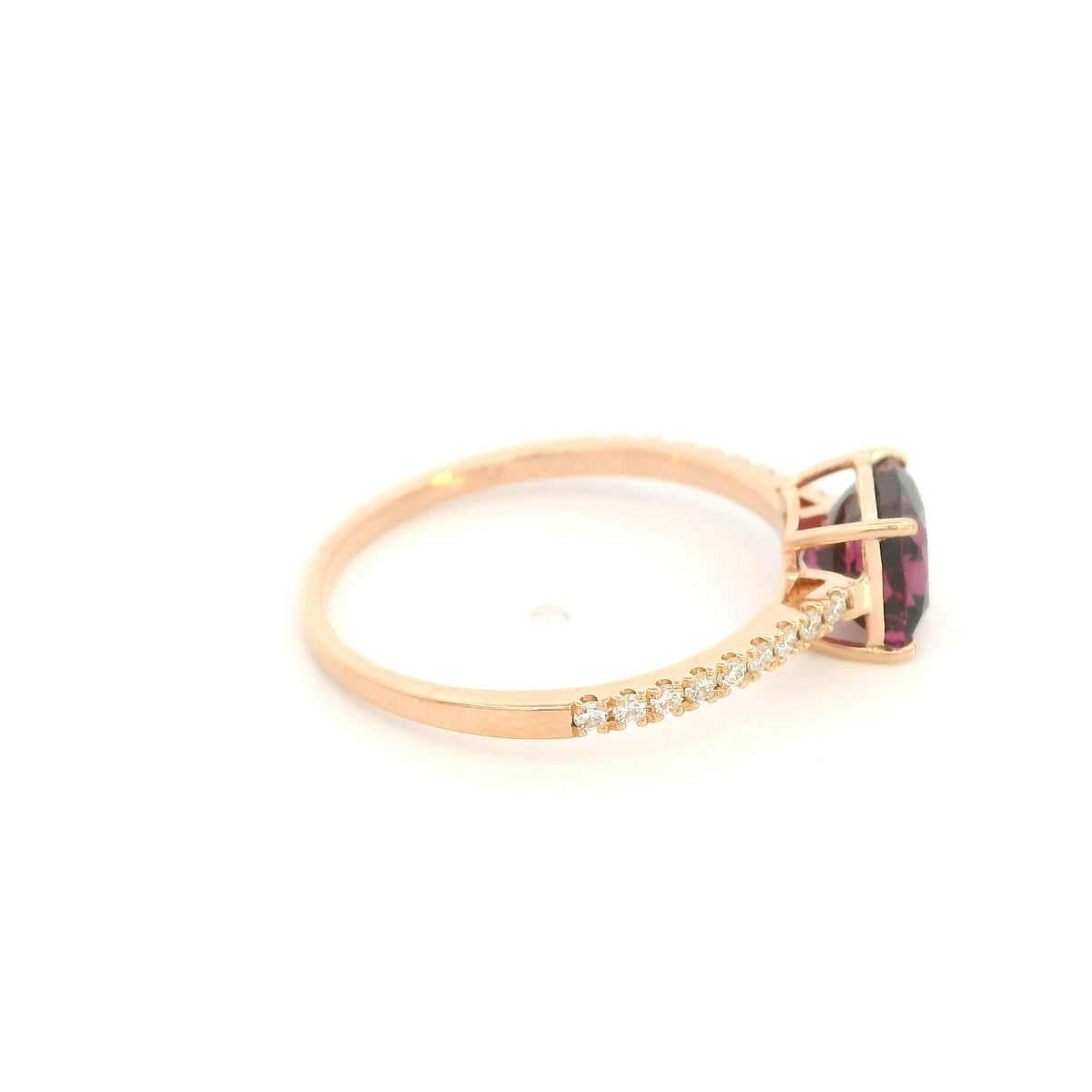 18K rose gold ring with a cushion-cut raspberry-pink rhodolite garnet and pavé diamond shoulders.