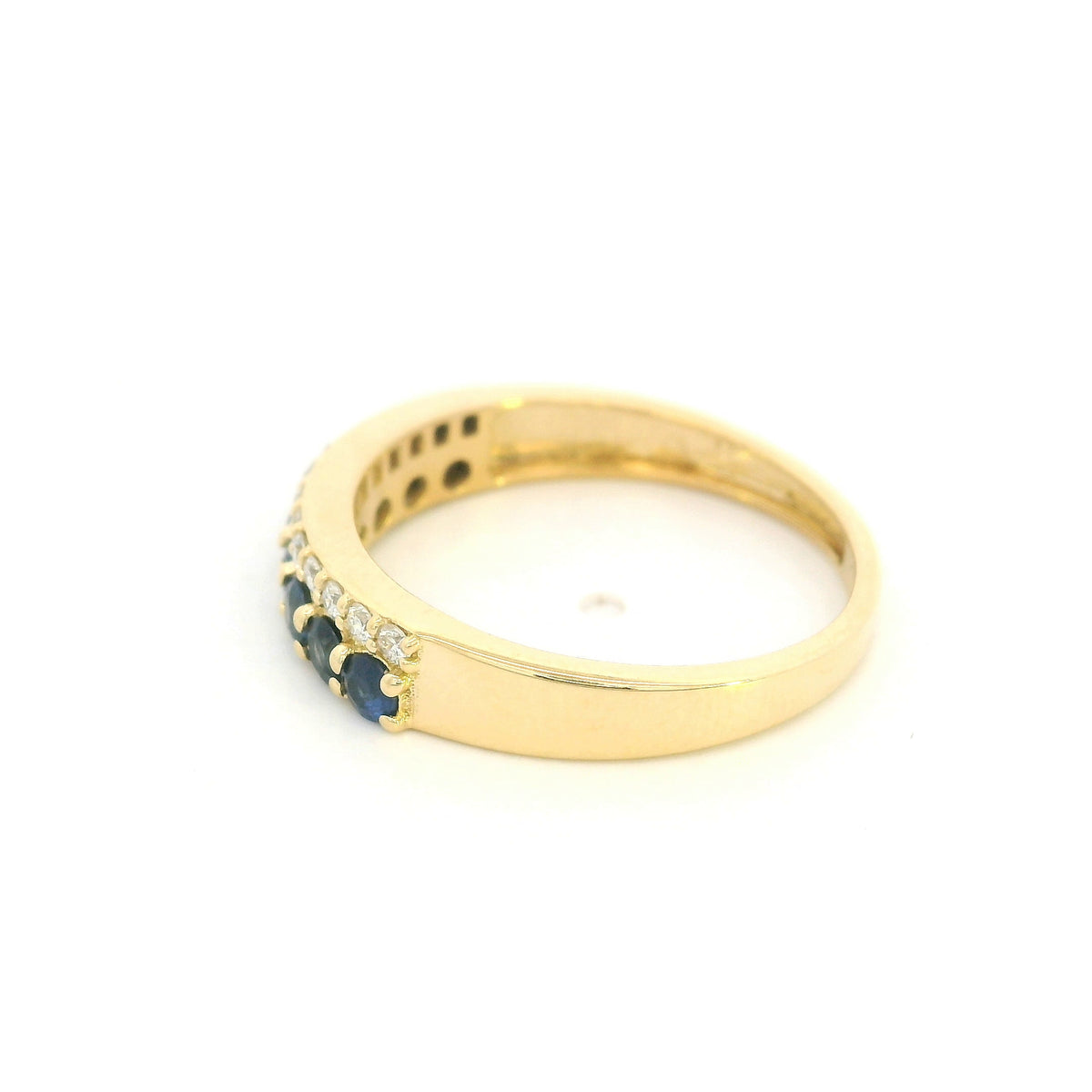 18K yellow gold band ring with two adjacent rows of round blue sapphires and white diamonds across the front.