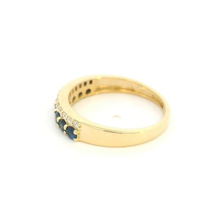 18K yellow gold band ring with two adjacent rows of round blue sapphires and white diamonds across the front.
