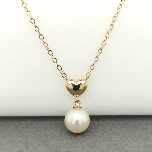 Fresh Water Pearl With A Heart Charm Pendant Necklace In 18k Yellow Gold.