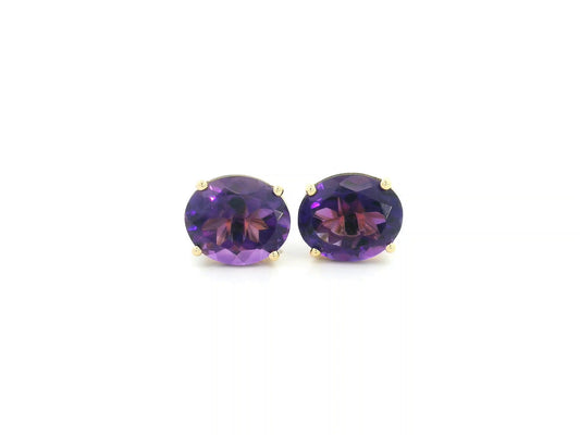 Oval amethyst stud earrings in 18K yellow gold featuring 8.25 carats of natural amethyst by Emirates Diamonds.