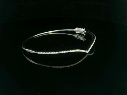 18K gold V-shape bangle bracelet with 0.34 carats of round-cut diamonds, featuring a modern tapered silhouette and minimalist design.