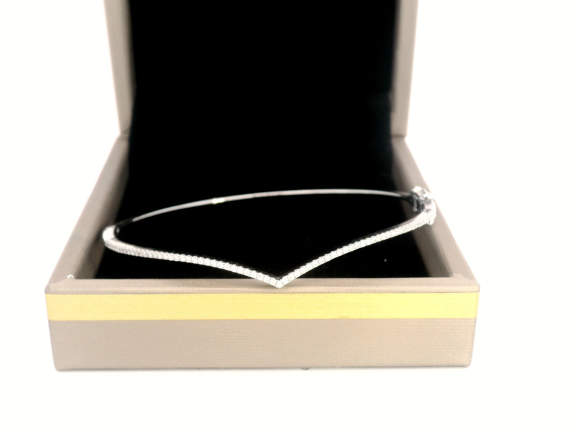 18K gold V-shape bangle bracelet with 0.34 carats of round-cut diamonds, featuring a modern tapered silhouette and minimalist design.