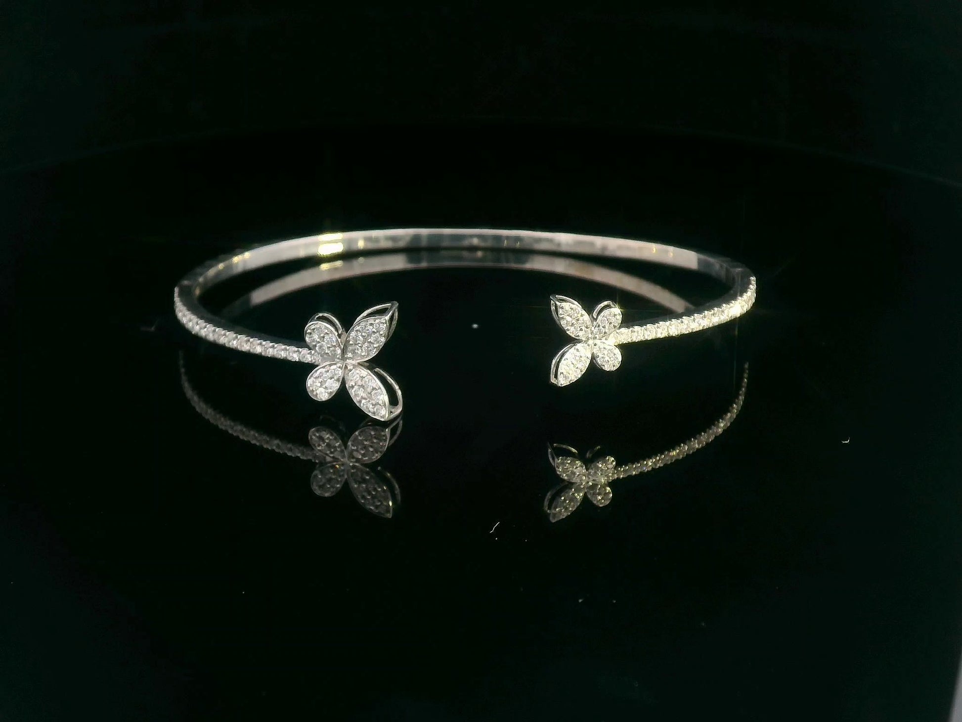 18K gold butterfly bangle with 0.86 carat pavé diamonds in open cuff design

