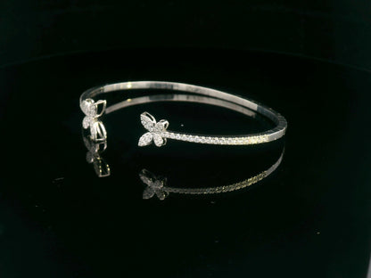 18K gold butterfly bangle with 0.86 carat pavé diamonds in open cuff design

