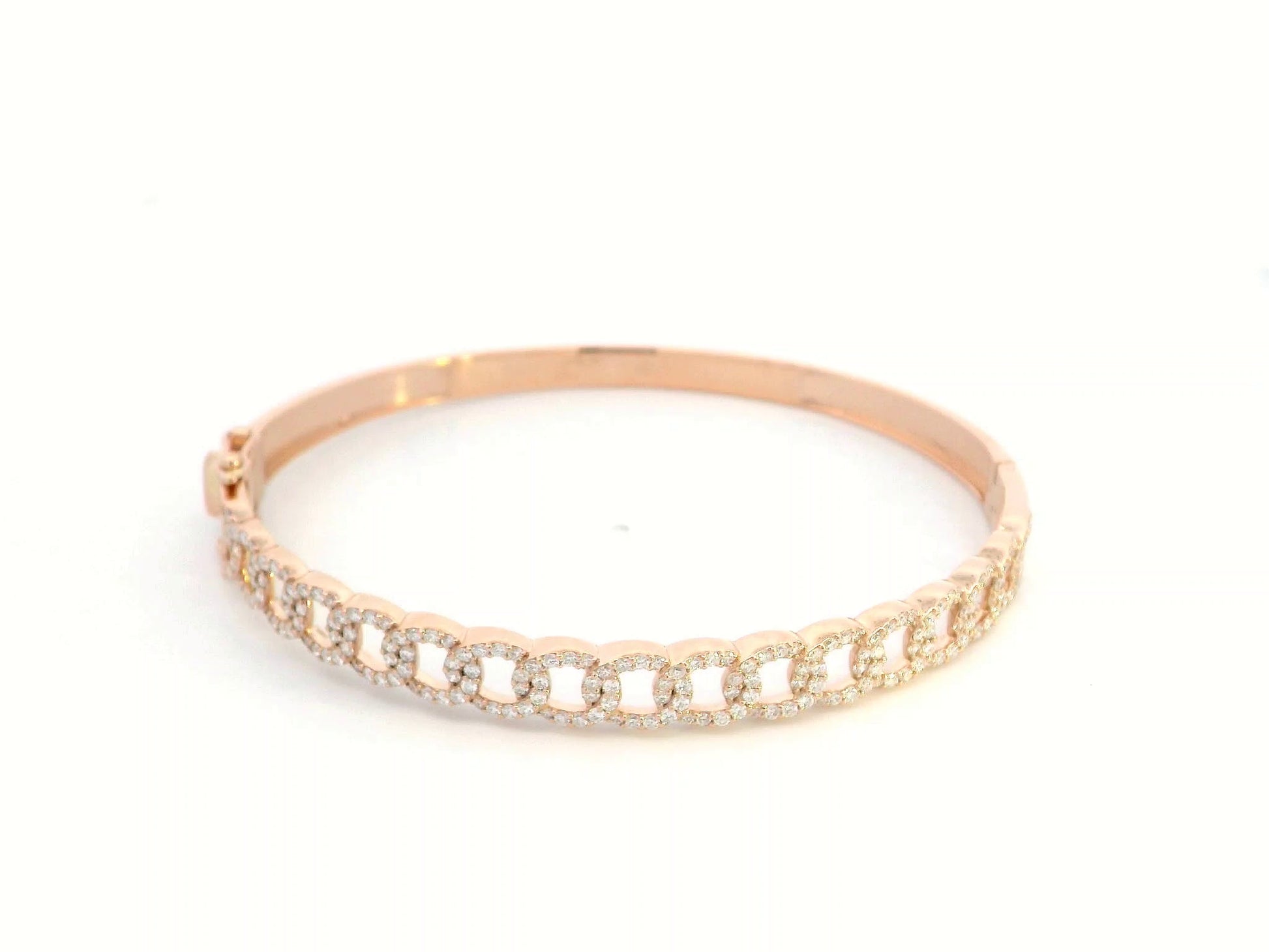 Unisex Cuban link diamond bangle in 18K rose gold with 1.26 carats of round-cut diamonds.