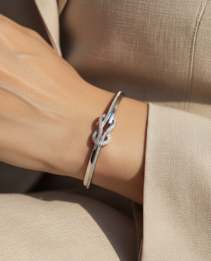 18K white gold diamond knot bangle with pavé-set natural diamonds by Emirates Diamonds