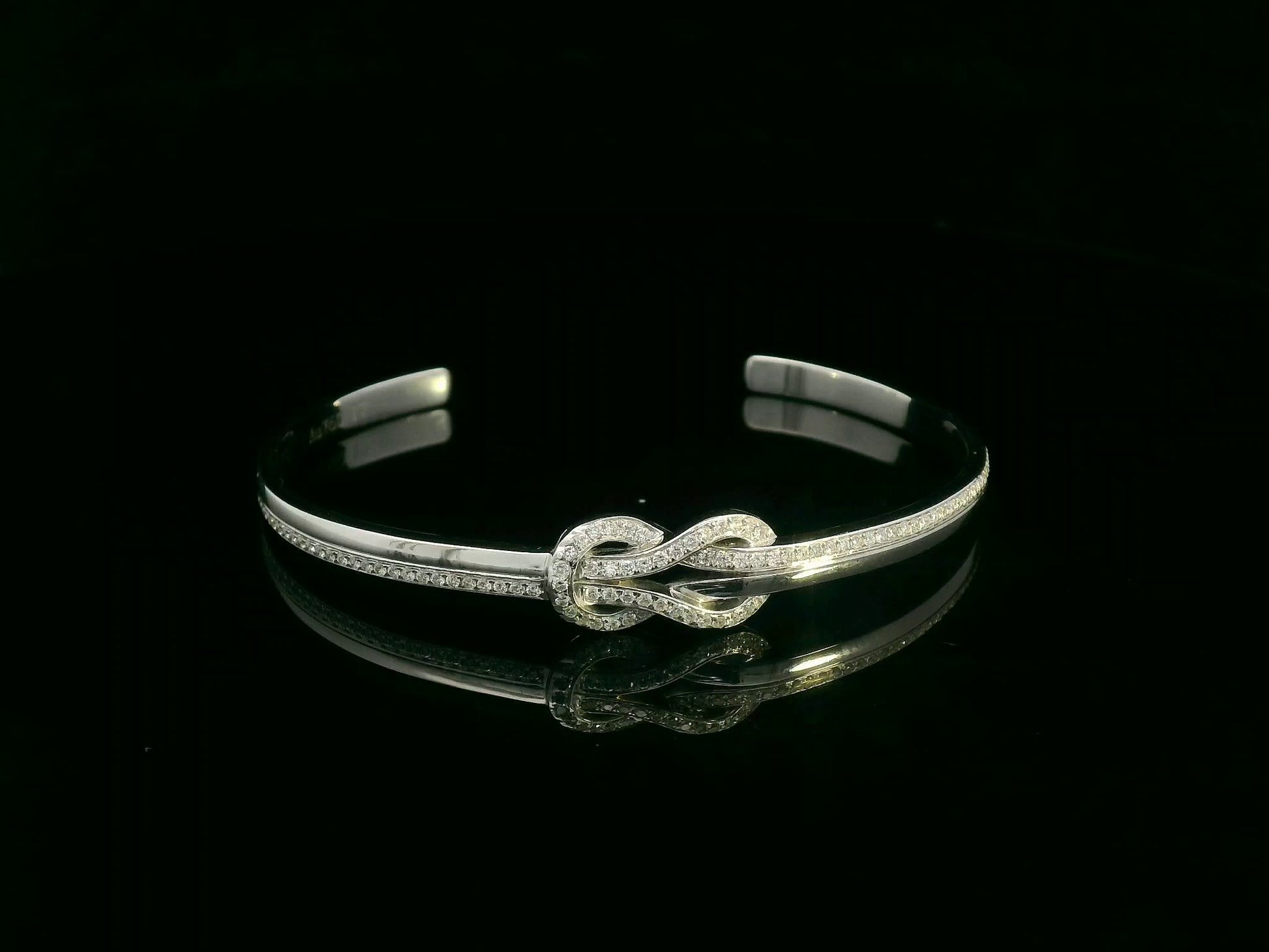 18K white gold diamond knot bangle with pavé-set natural diamonds by Emirates Diamonds