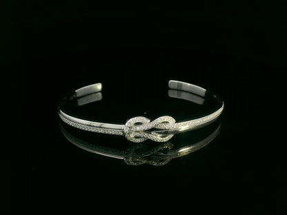 18K white gold diamond knot bangle with pavé-set natural diamonds by Emirates Diamonds