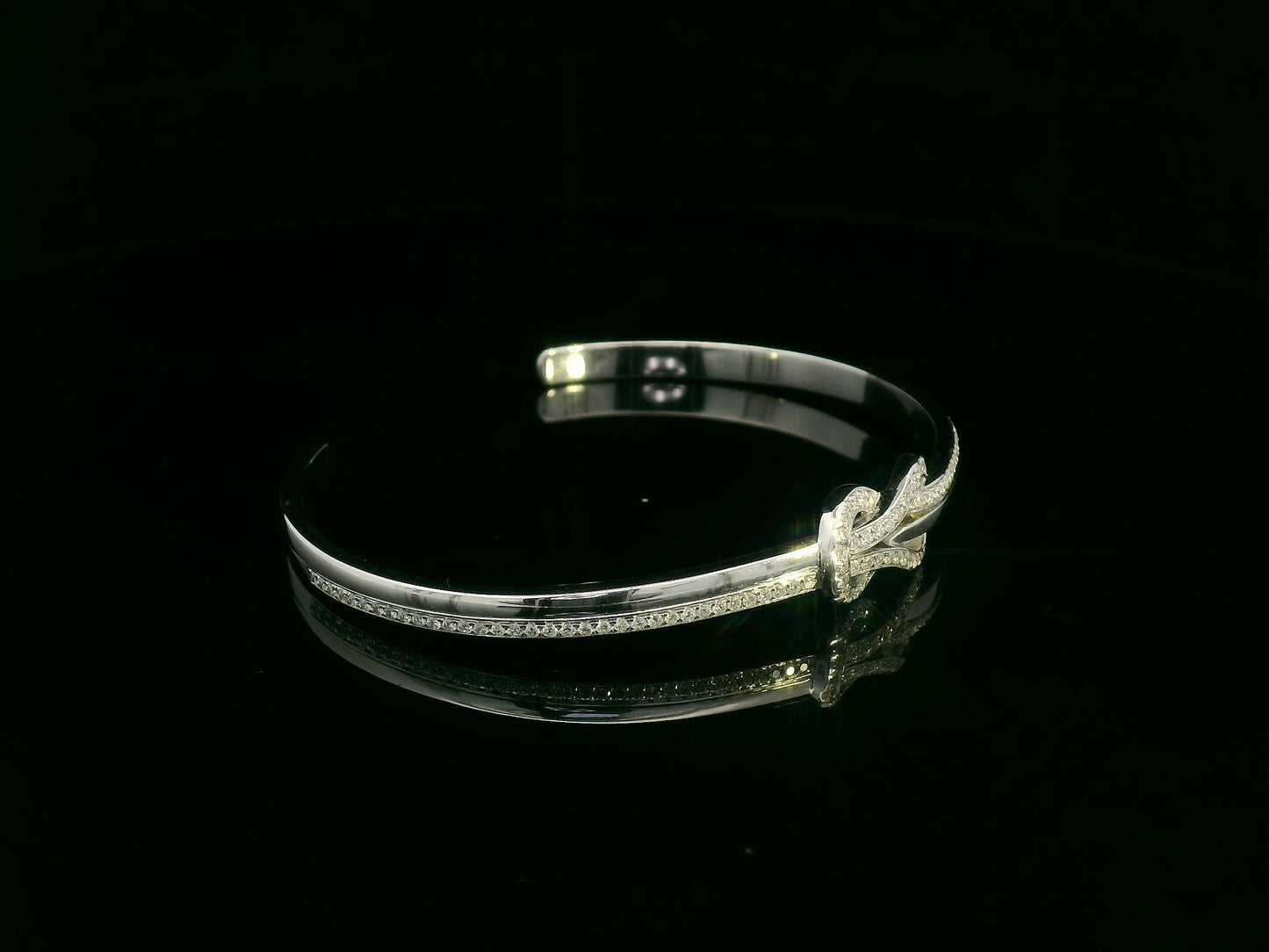 18K white gold diamond knot bangle with pavé-set natural diamonds by Emirates Diamonds