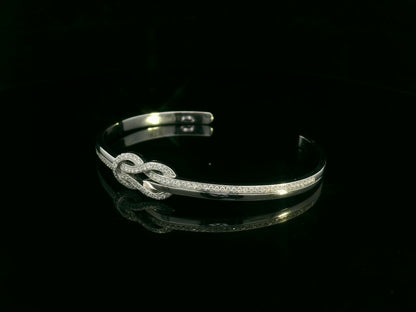 18K white gold diamond knot bangle with pavé-set natural diamonds by Emirates Diamonds