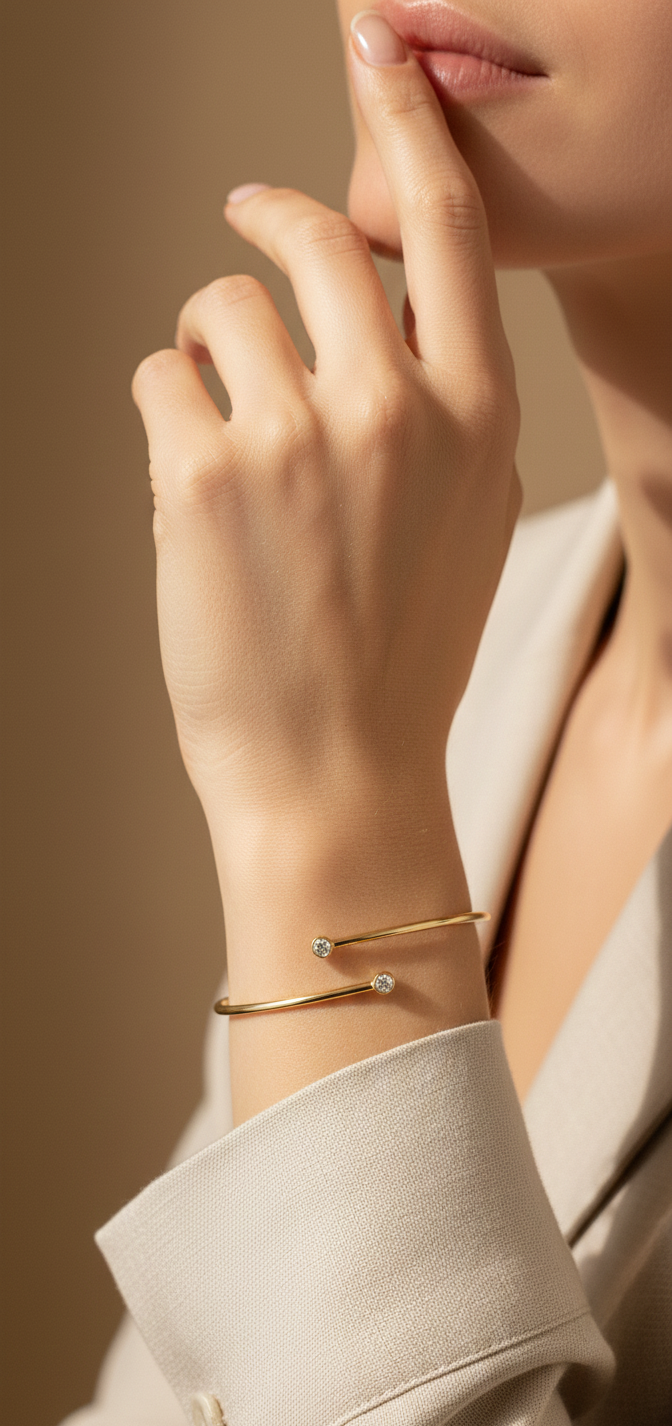 Diamond open cuff bangle bracelet in 18K yellow gold with bezel set diamonds by Emirates Diamonds