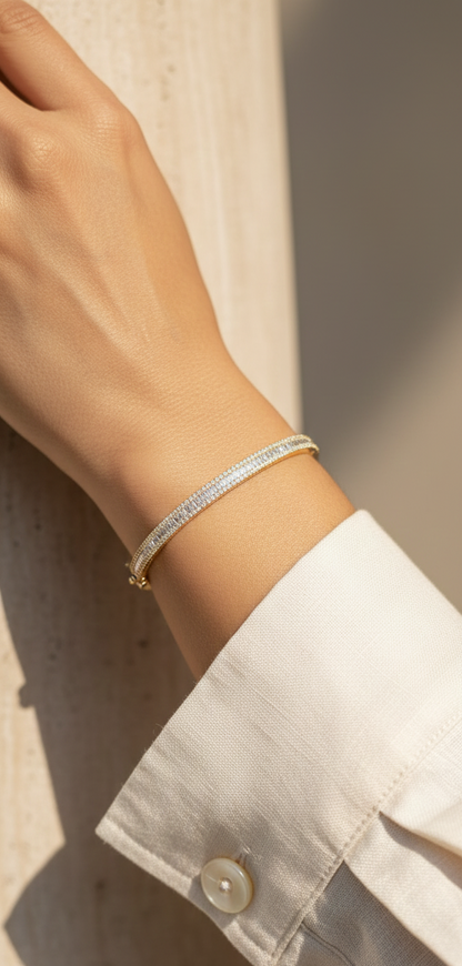 Round and baguette diamond bangle bracelet in 18K yellow gold with 1.57 carats of diamonds by Emirates Diamonds