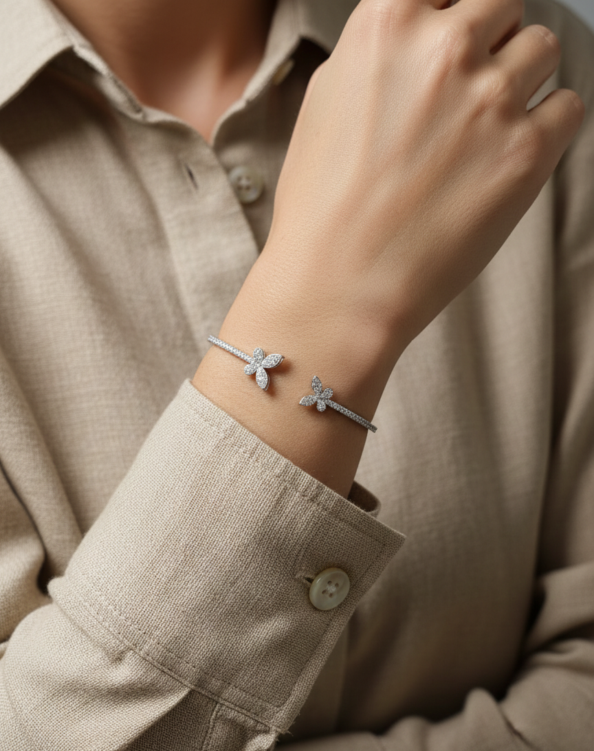 0.85 carat diamond butterfly bangle in 18K white gold by Emirates Diamonds with pavé diamond band.