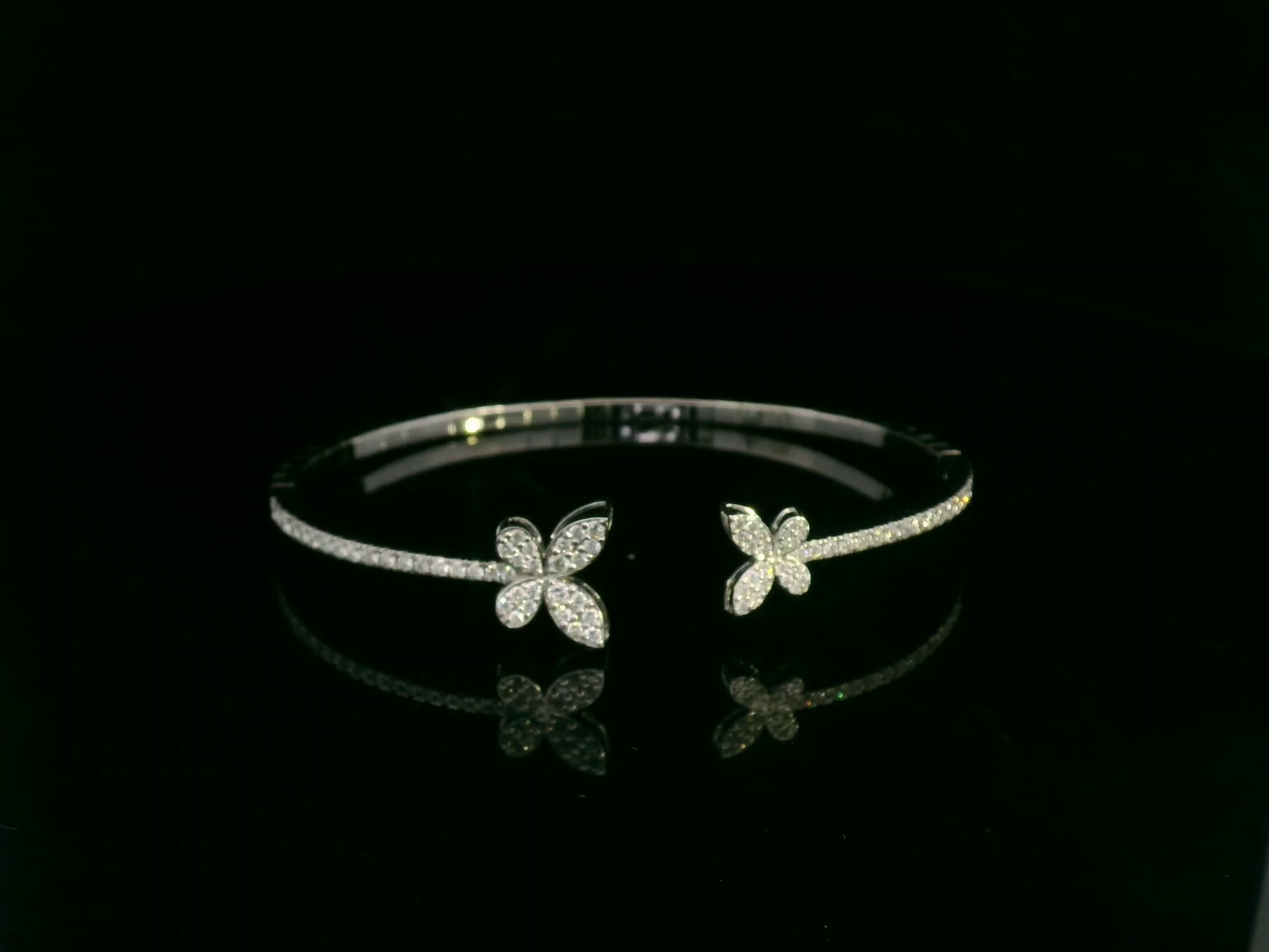 0.85 carat diamond butterfly bangle in 18K white gold by Emirates Diamonds with pavé diamond band.