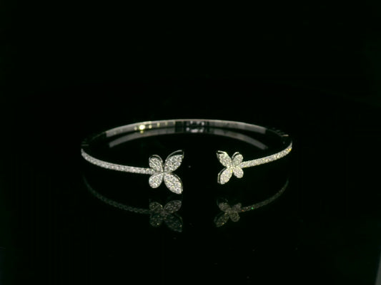0.85 carat diamond butterfly bangle in 18K white gold by Emirates Diamonds with pavé diamond band.