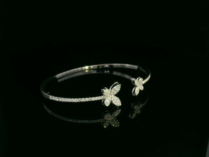 0.85 carat diamond butterfly bangle in 18K white gold by Emirates Diamonds with pavé diamond band.