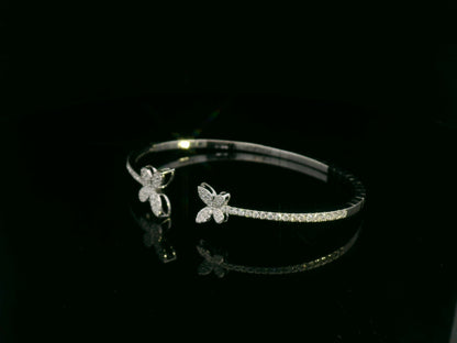 0.85 carat diamond butterfly bangle in 18K white gold by Emirates Diamonds with pavé diamond band.