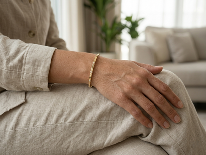 Minimal diamond bangle bracelet in 18K yellow gold with bezel-set natural diamonds