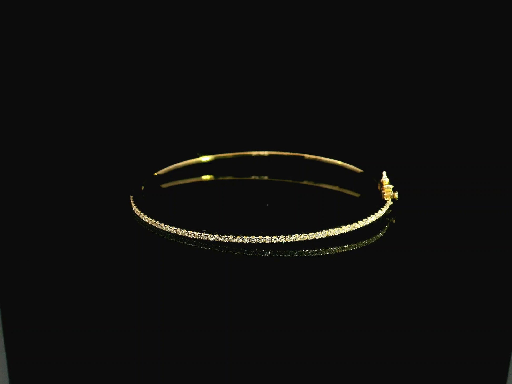 18K yellow gold diamond bangle featuring 0.54 carat natural diamonds in an elegant open bangle bracelet design.
