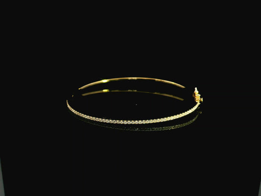 18K yellow gold diamond bangle featuring 0.54 carat natural diamonds in an elegant open bangle bracelet design.