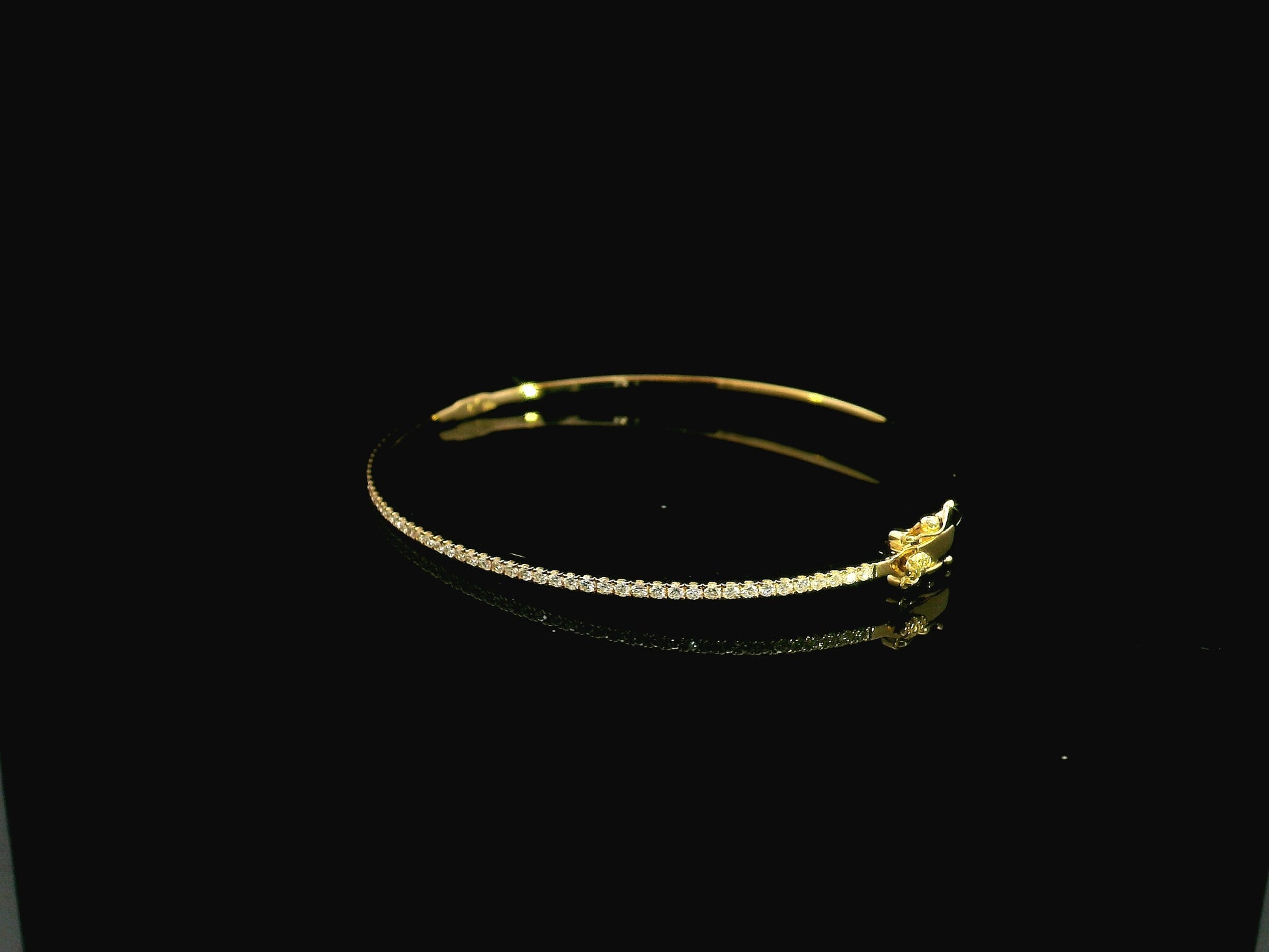 18K yellow gold diamond bangle featuring 0.54 carat natural diamonds in an elegant open bangle bracelet design.