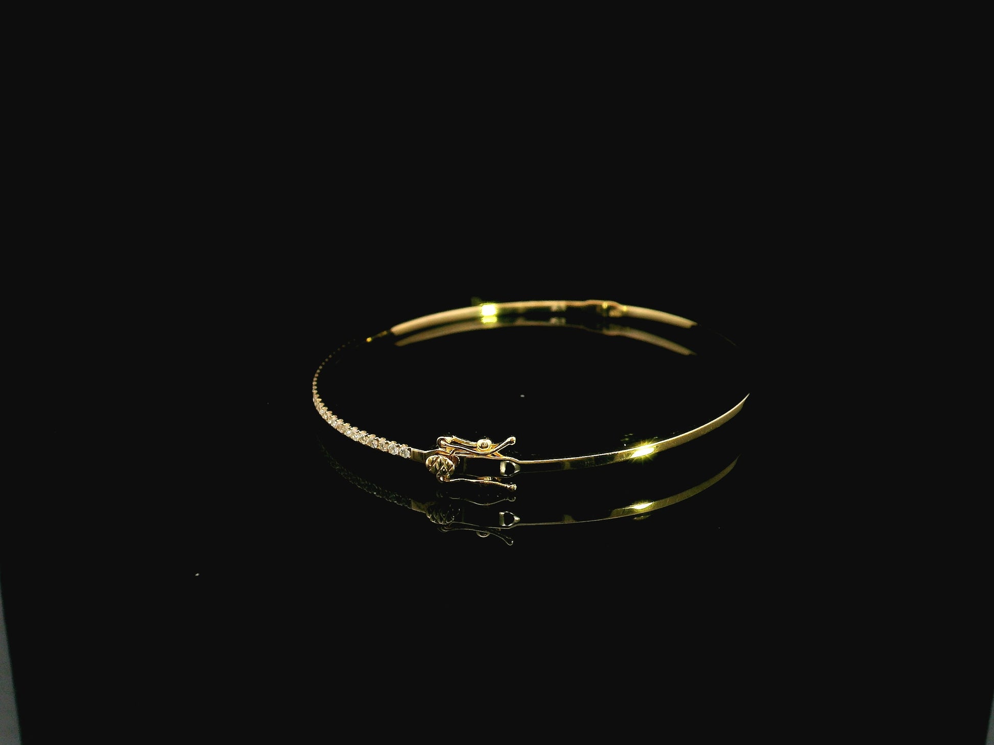 18K yellow gold diamond bangle featuring 0.54 carat natural diamonds in an elegant open bangle bracelet design.