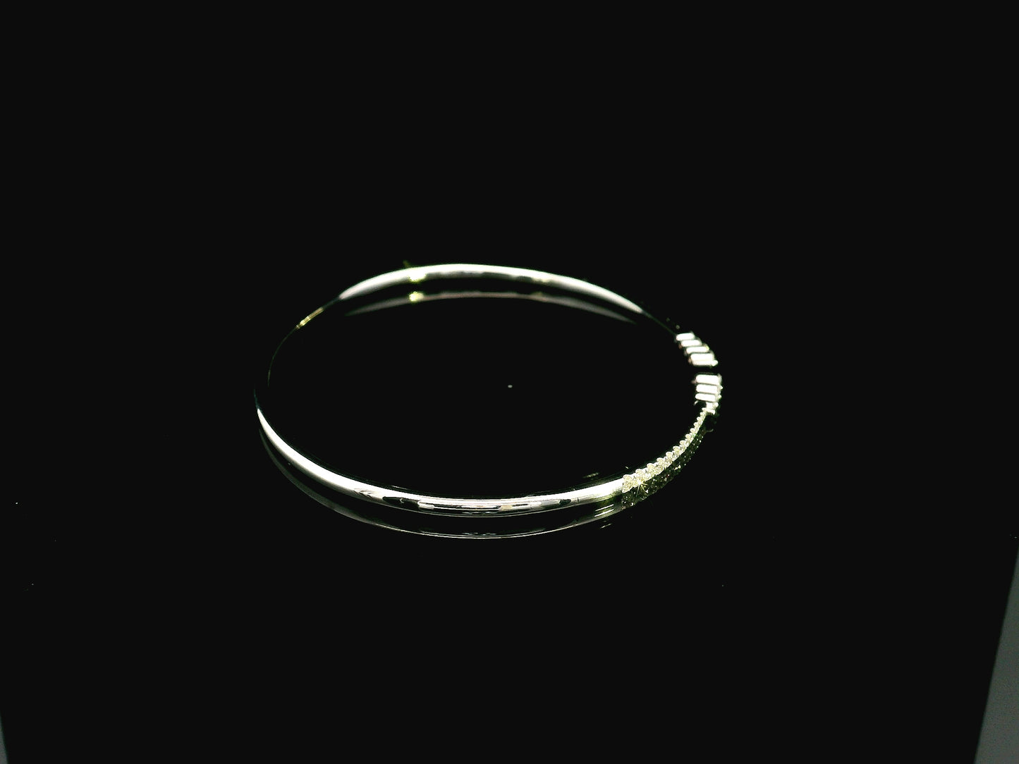 18K white gold diamond bangle featuring 0.54 carat natural diamonds in an elegant open bangle design.